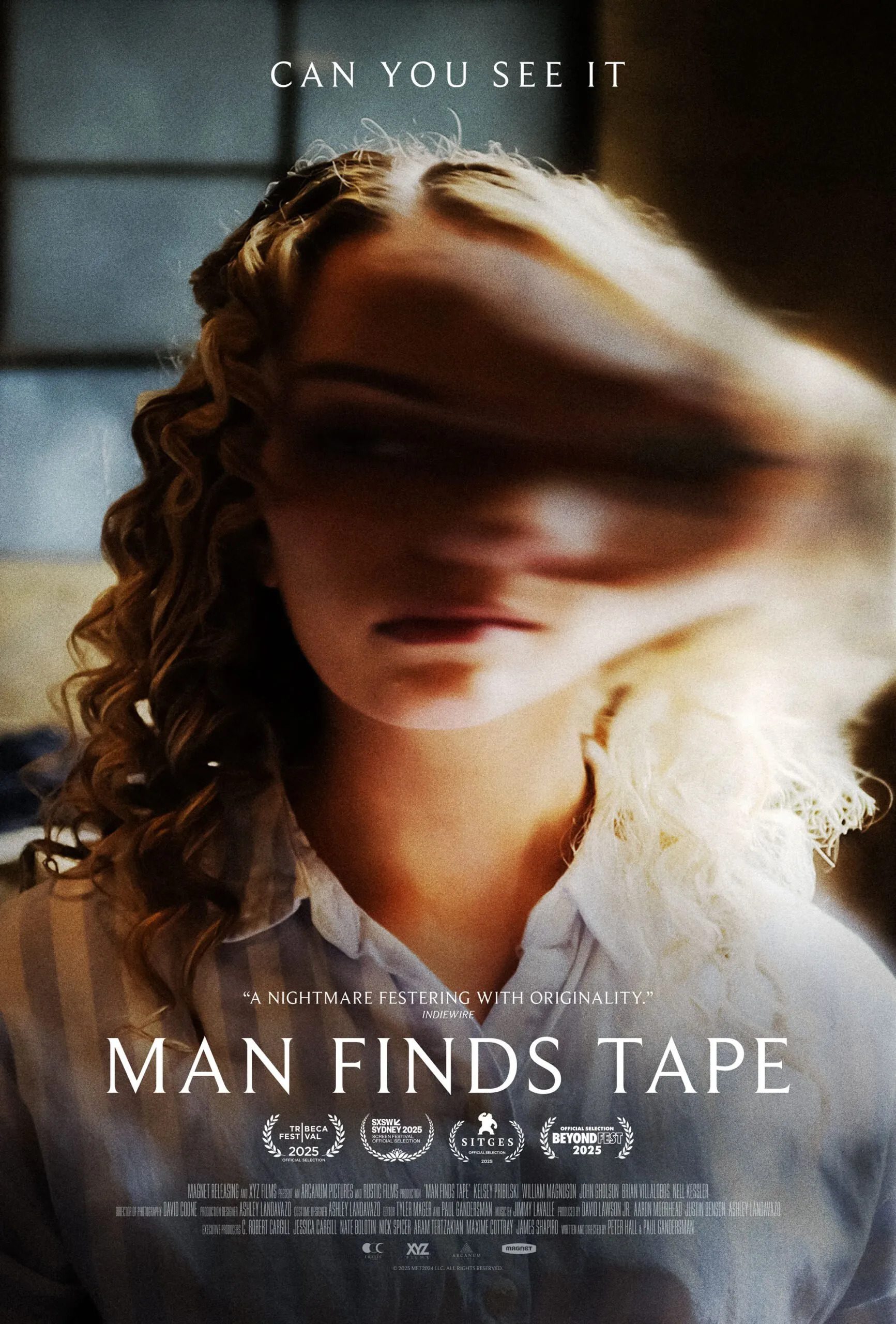 This is a poster for the movie "Man Finds Tape."